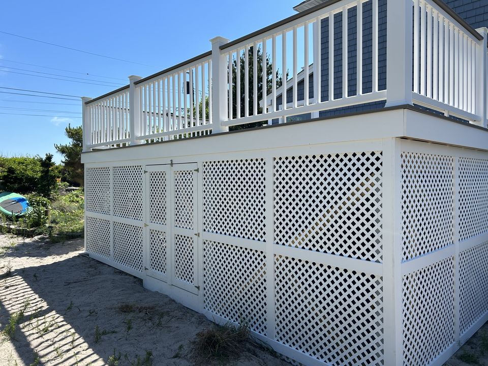 Lattice skirting with built in storage doors under a raised deck