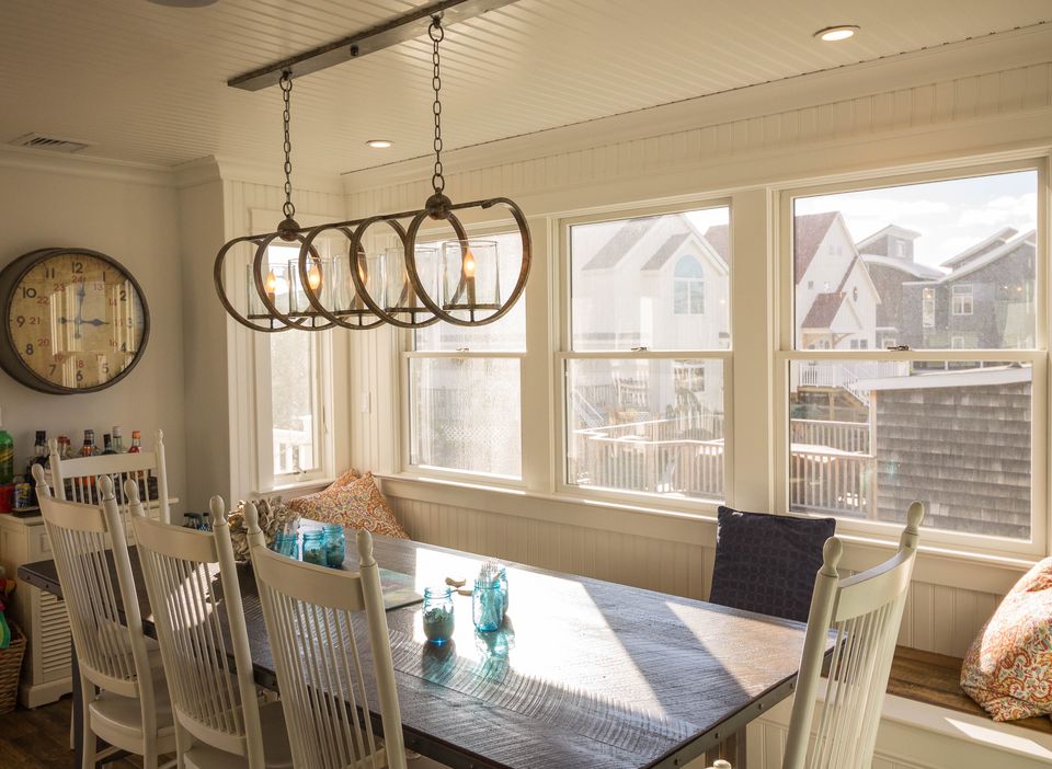 Dining nook with a loop pendant and a window seat
