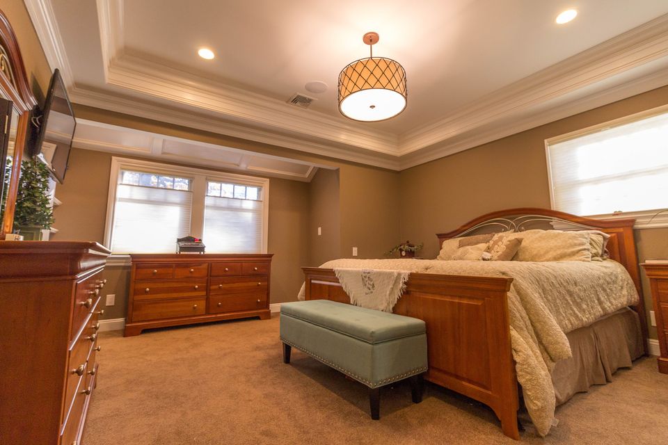 Primary bedroom with a tray ceiling