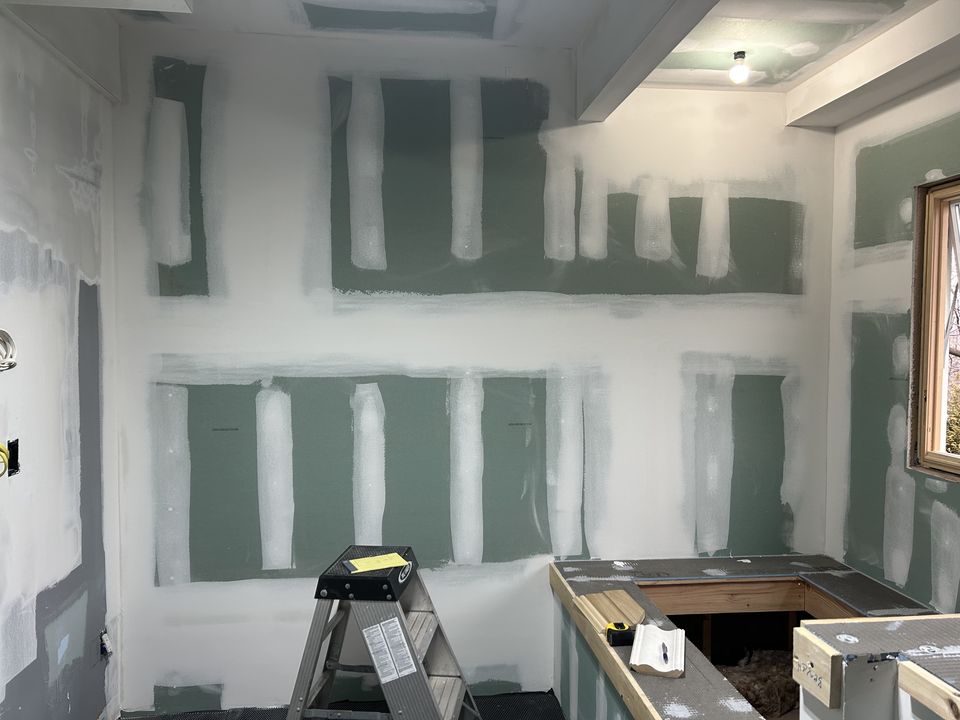Primary bath in taped drywall, with the vanity base framed