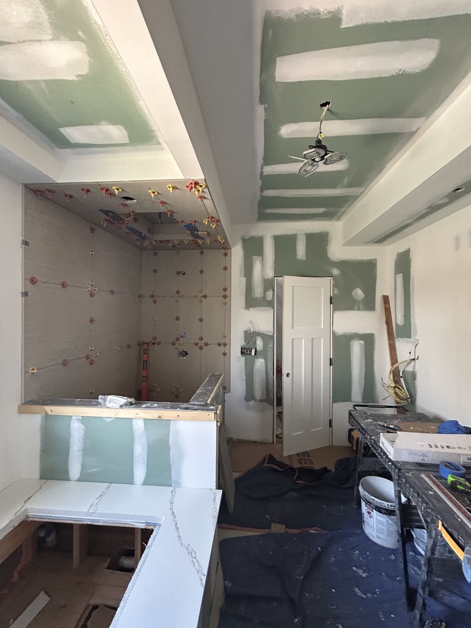 Shower tile going up, with the quartz vanity top set