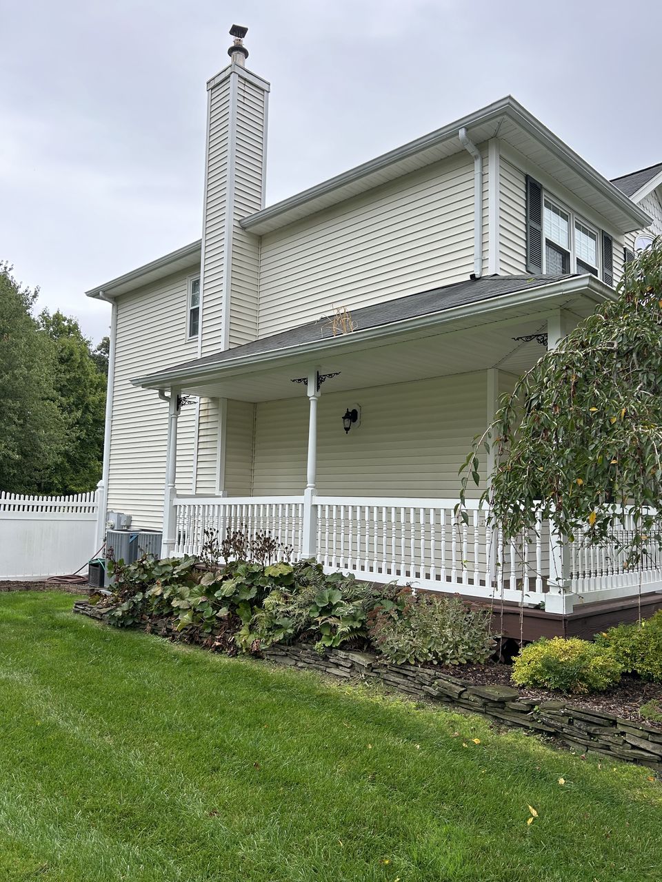 Before: the farmer's porch wrapping the side of the house