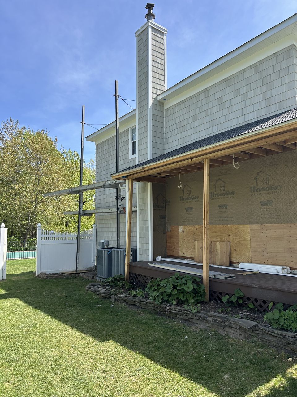 Cedar shake wall above the new covered porch
