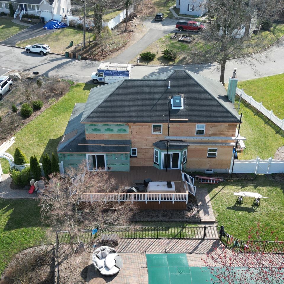 The rear from the air during the rebuild, in house wrap above the deck