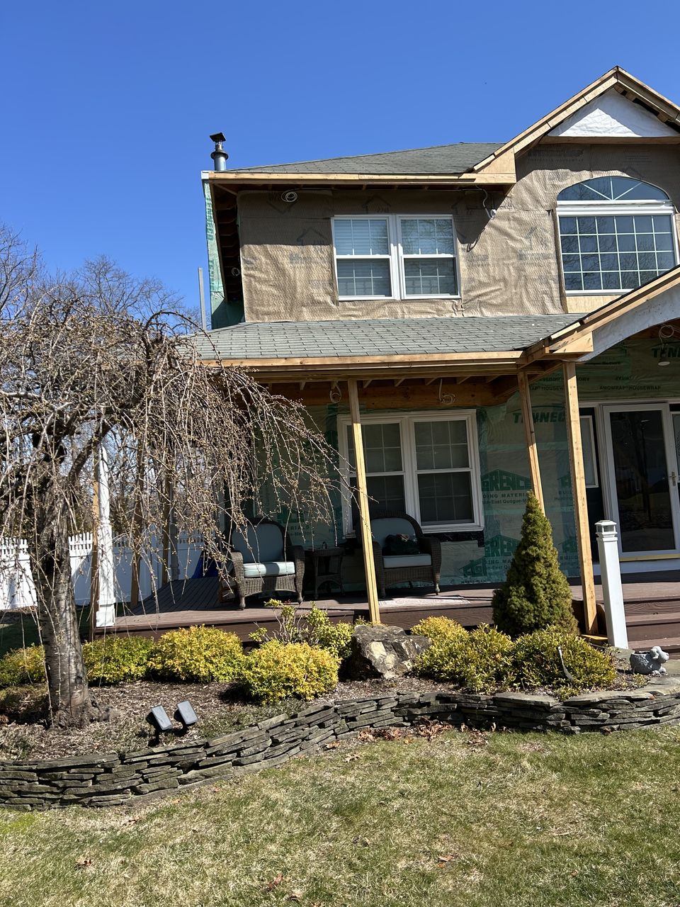 New porch framing and house wrap at the front corner