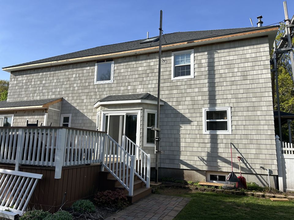 Rear of the house in new cedar shake, with staging still up