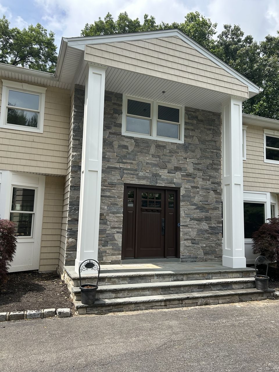 Stone veneer entry on a two story home