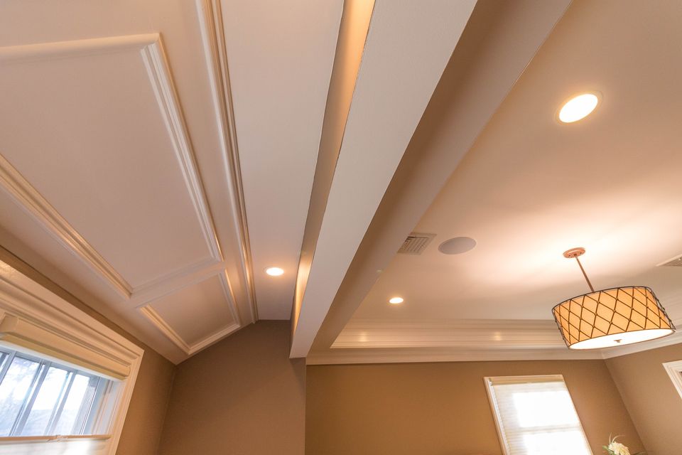 Tray ceiling detail with a drum pendant
