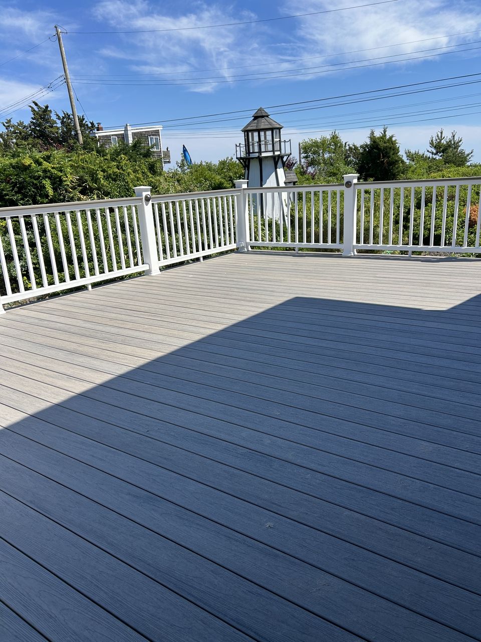 Wide composite deck with white vinyl rails